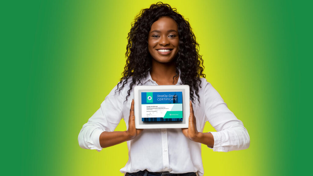 Businesswoman smiling and holding an iPad containing a certificate of completion