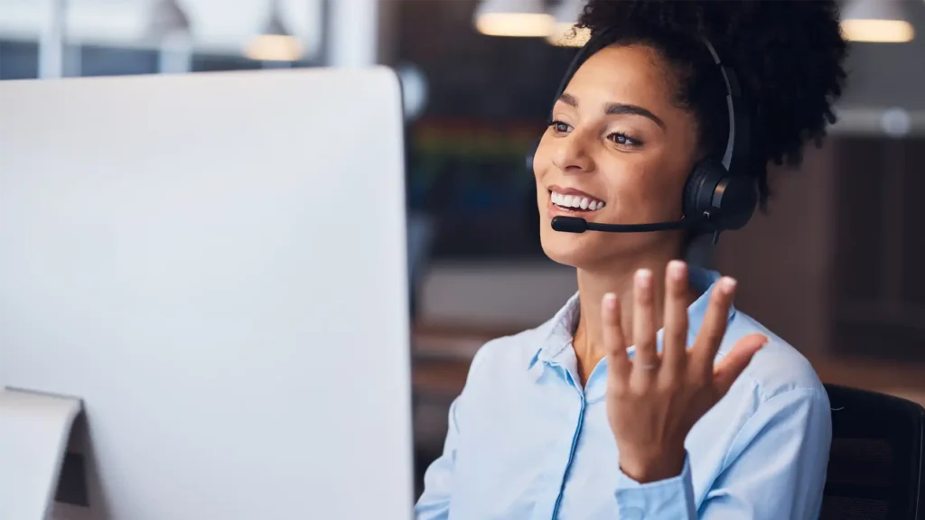 image of a woman wearing a headset representing a globalmeet conference call operator