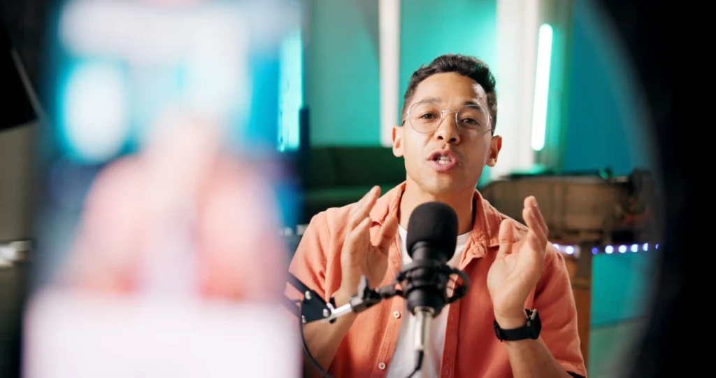 image mockup of a young businessman talking into a mic while using globalmeet's virtual conference software